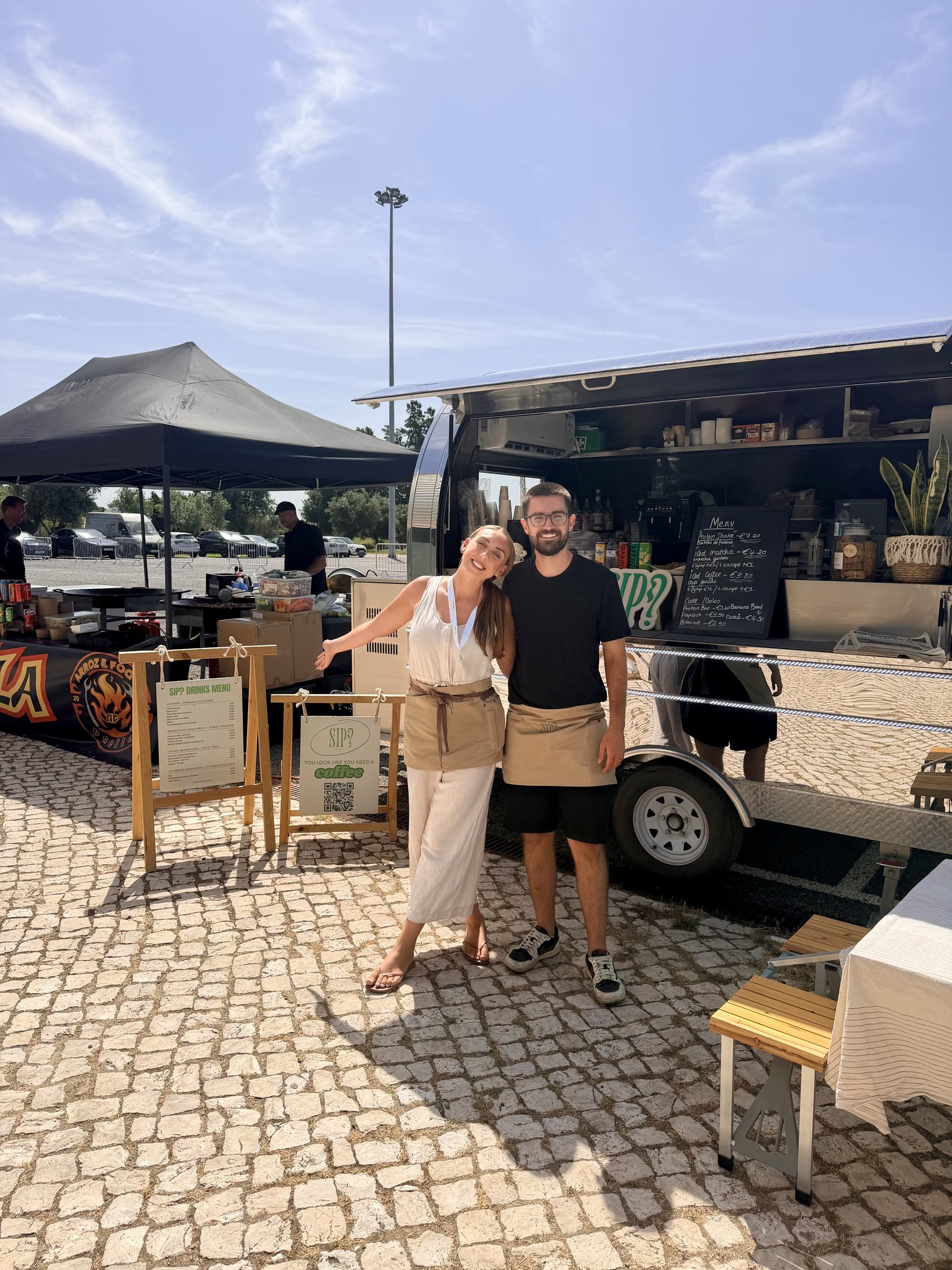 Ellie and Dan, the owners of SIP? Algarve, in front of their coffee van